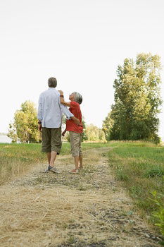 Similar – Image, Stock Photo Grandfather putting shoe to his grandson outdoors