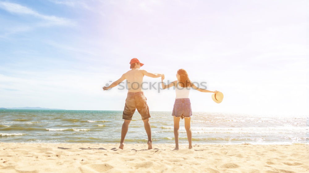 Similar – Happy family walking on the beach at the day time.