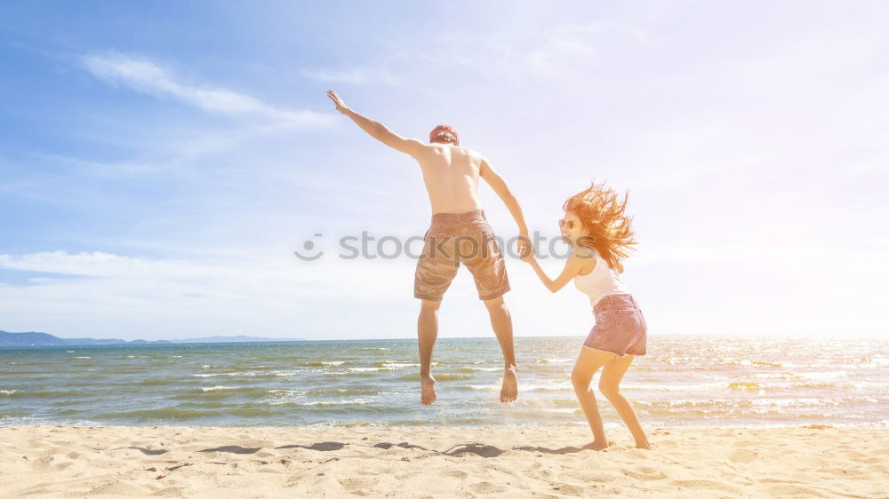 Similar – Father and daughter with balloons playing on the beach