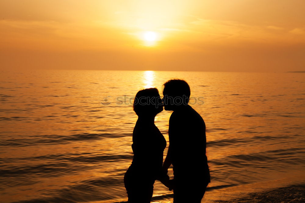 Similar – Image, Stock Photo Mother and son playing on the coast of lake at the sunset time