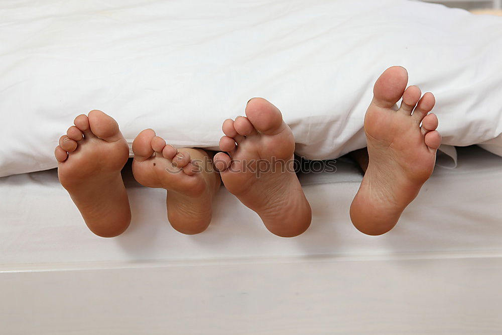 Image, Stock Photo close up feet of a couple under the white sheets blanket in bed,