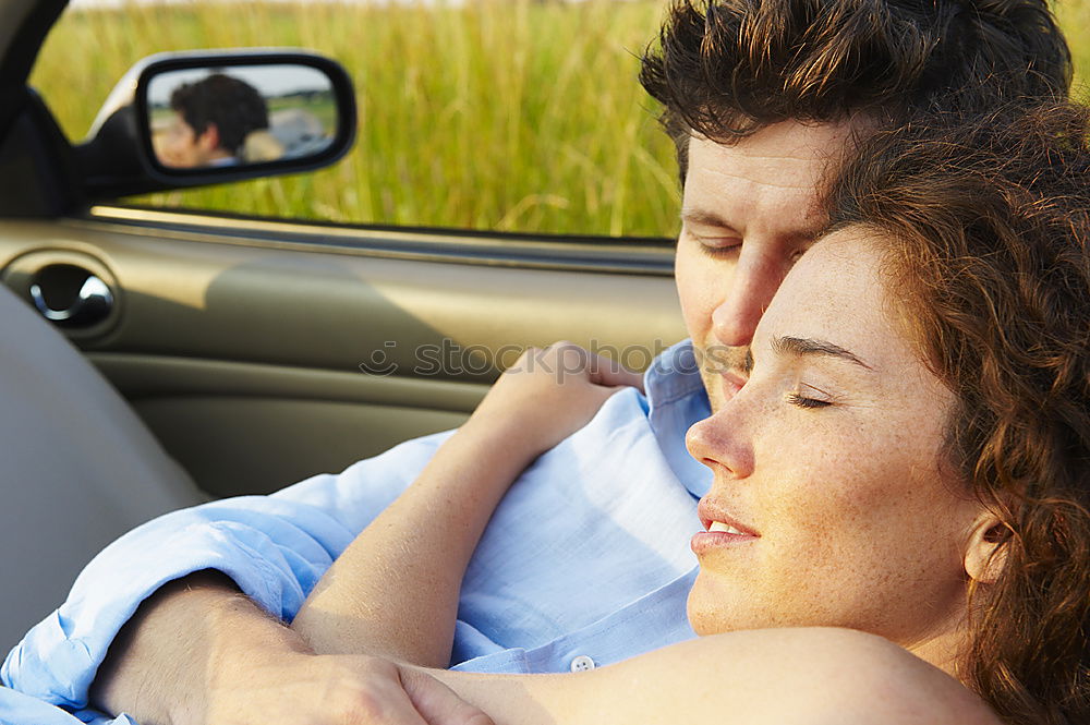 Similar – Young couple kissing through of glass car