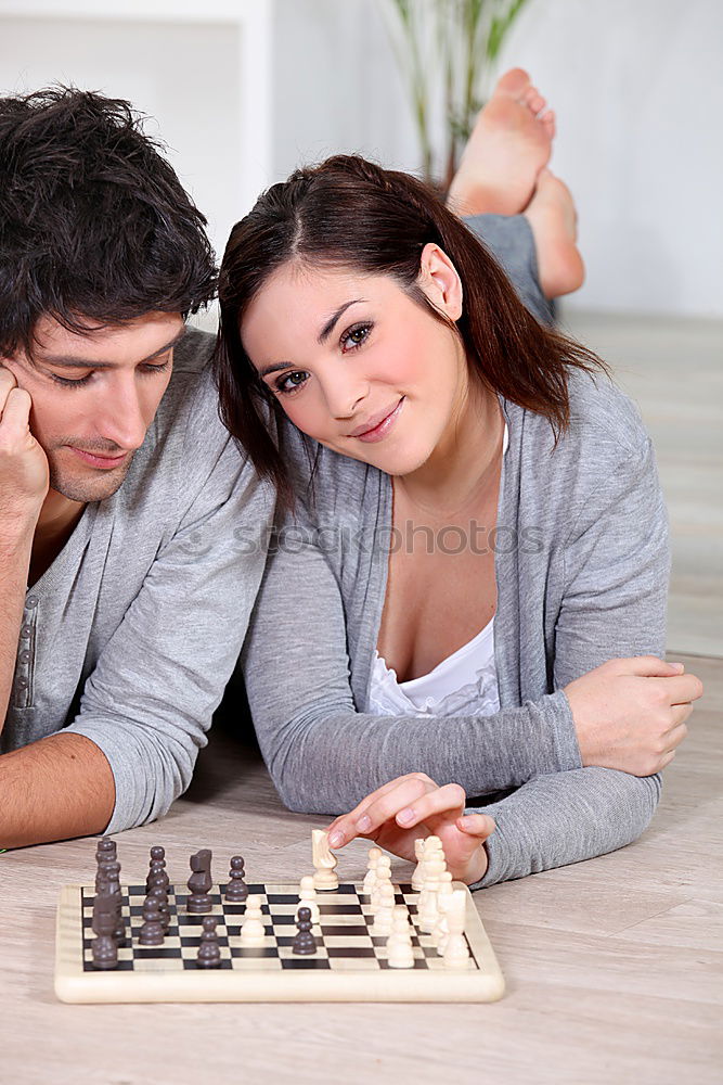 Similar – child girl playing checkers with dad