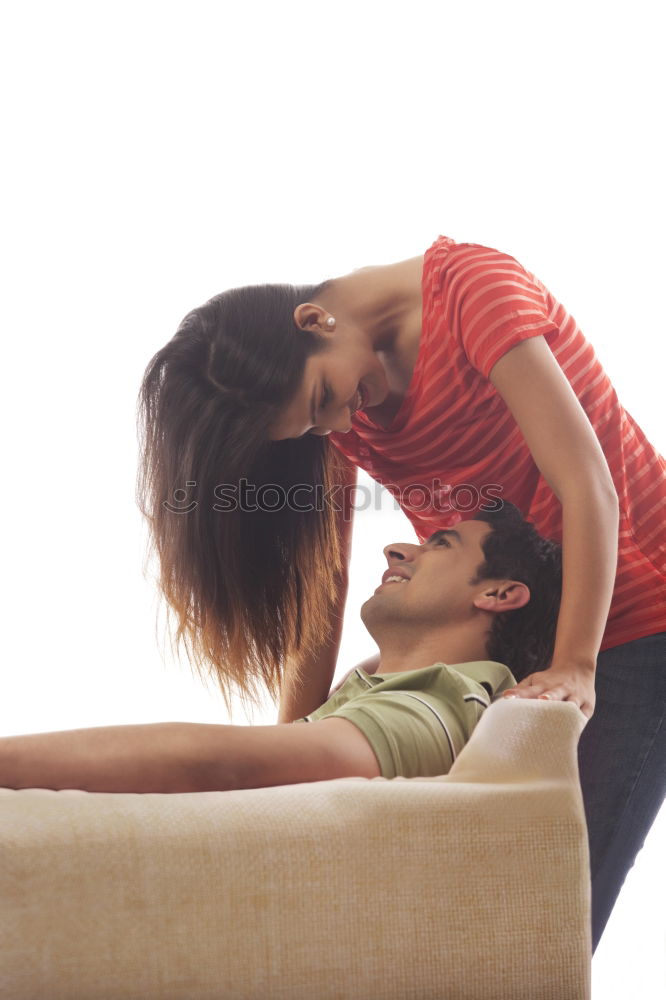 Similar – Image, Stock Photo young, slim, leggy woman sits barefoot in hotpants on the edge of a sofa and lets her long hair fall over her face