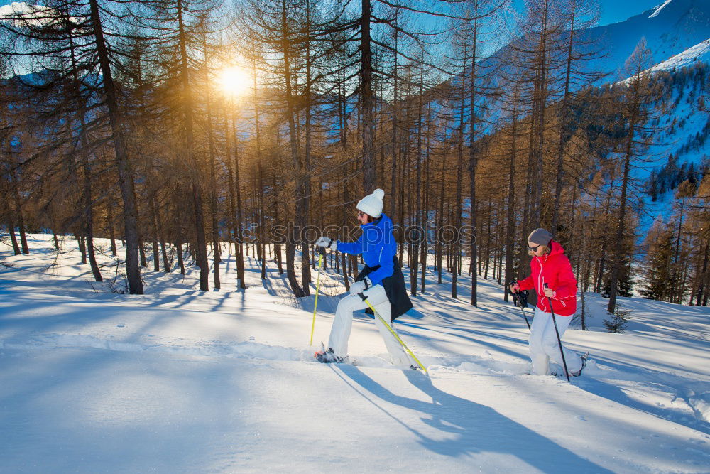 Similar – Young family with children go sledding in winter sunshine