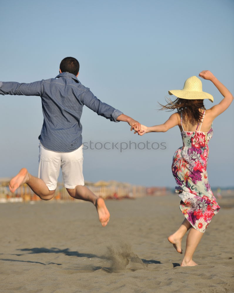 Similar – Image, Stock Photo Father and son playing football on the beach at the day time. Concept of friendly family.