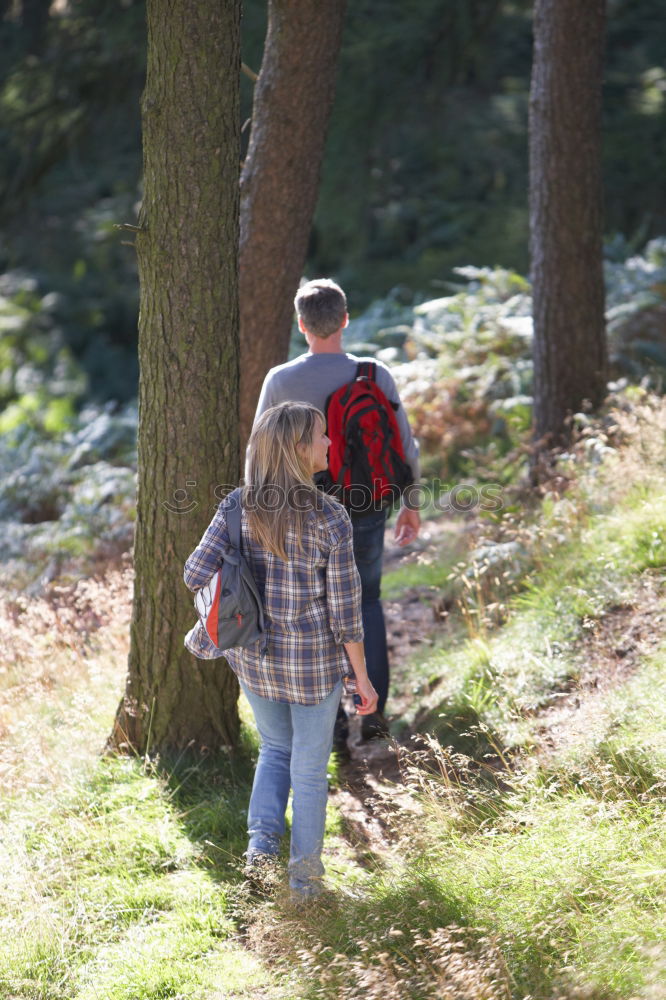 Similar – Boy and girl wandering in a forest on summer day