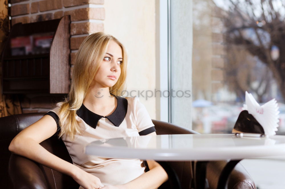 Similar – Image, Stock Photo Smiling blond woman sitting in a bar with a cappuccino