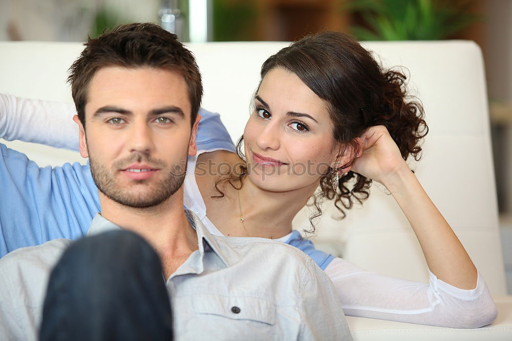 Similar – Image, Stock Photo Young couple reading book on couch at home