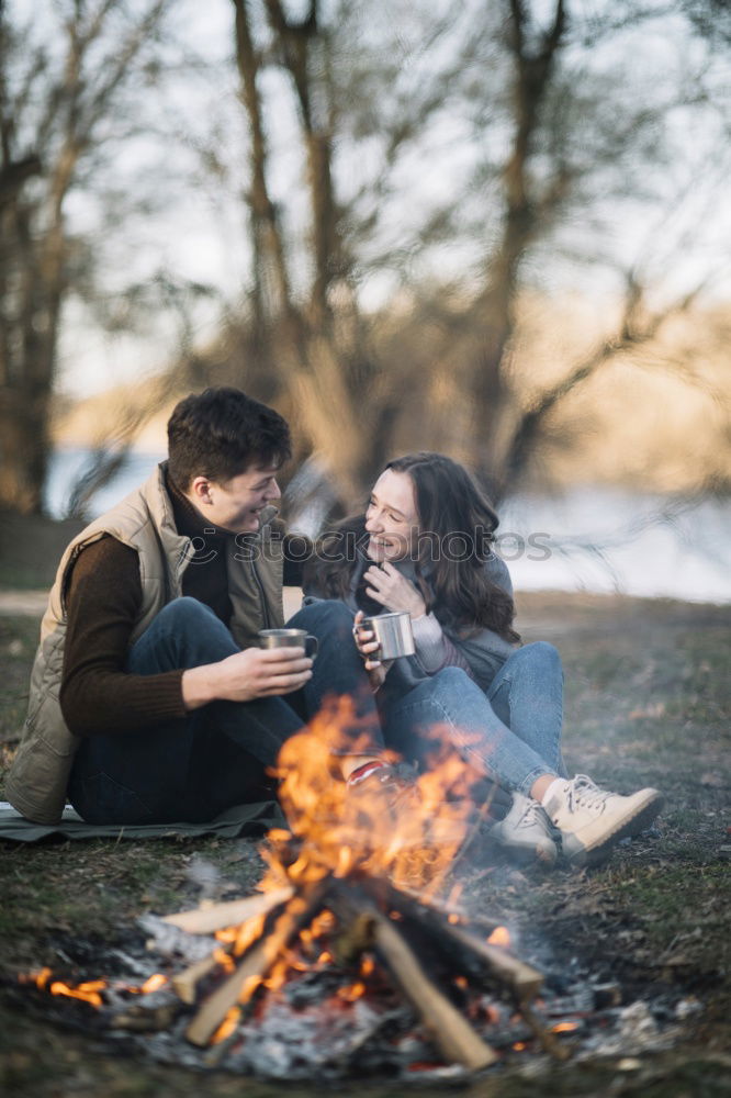 Similar – Image, Stock Photo Couple pausing while doing trekking