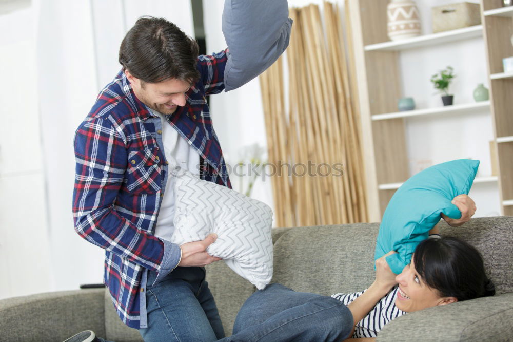 Similar – Image, Stock Photo Happy man listening and touching his pregnant wife tummy on the sofa at home