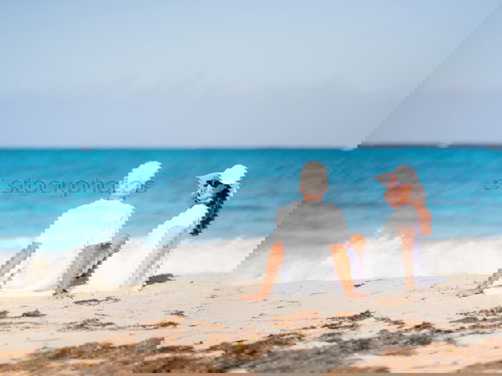 Similar – Image, Stock Photo Father and son playing on the beach at the day time. Concept of friendly family.