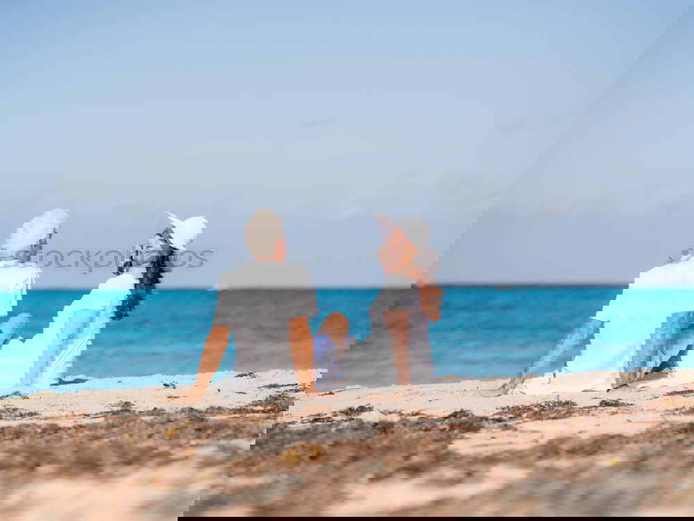 Similar – Image, Stock Photo Father and son playing on the beach at the day time. Concept of friendly family.
