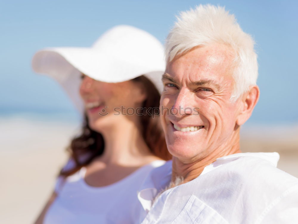 Similar – Senior man and woman having a run along the shore. Scene with sea, sand and trees. Healthy and active way of life