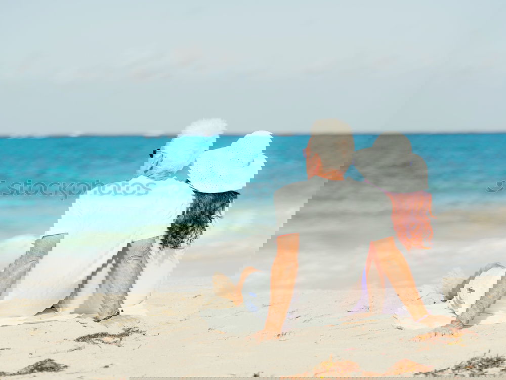 Similar – Image, Stock Photo Father and son playing on the beach at the day time. Concept of friendly family.