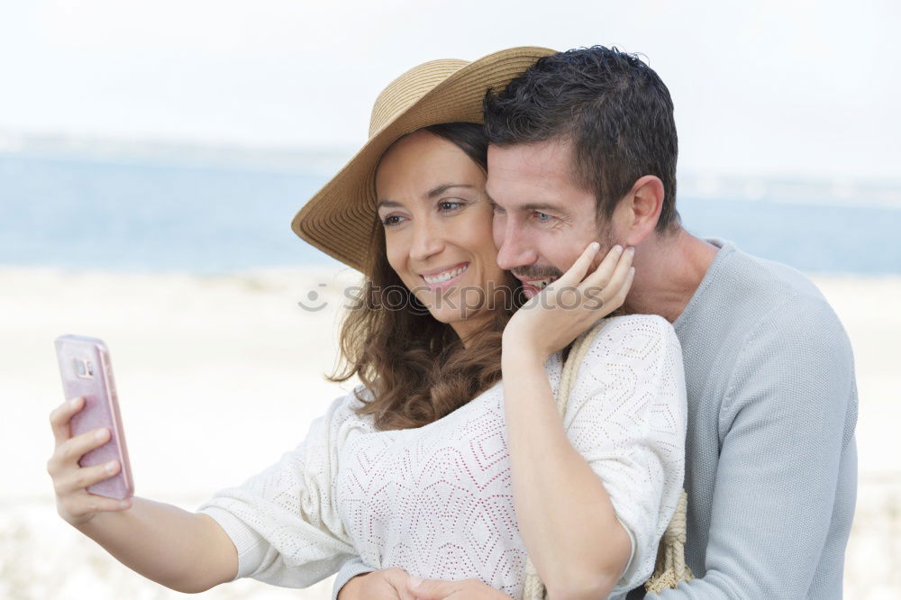 Similar – young cheerful couple taking a selfie