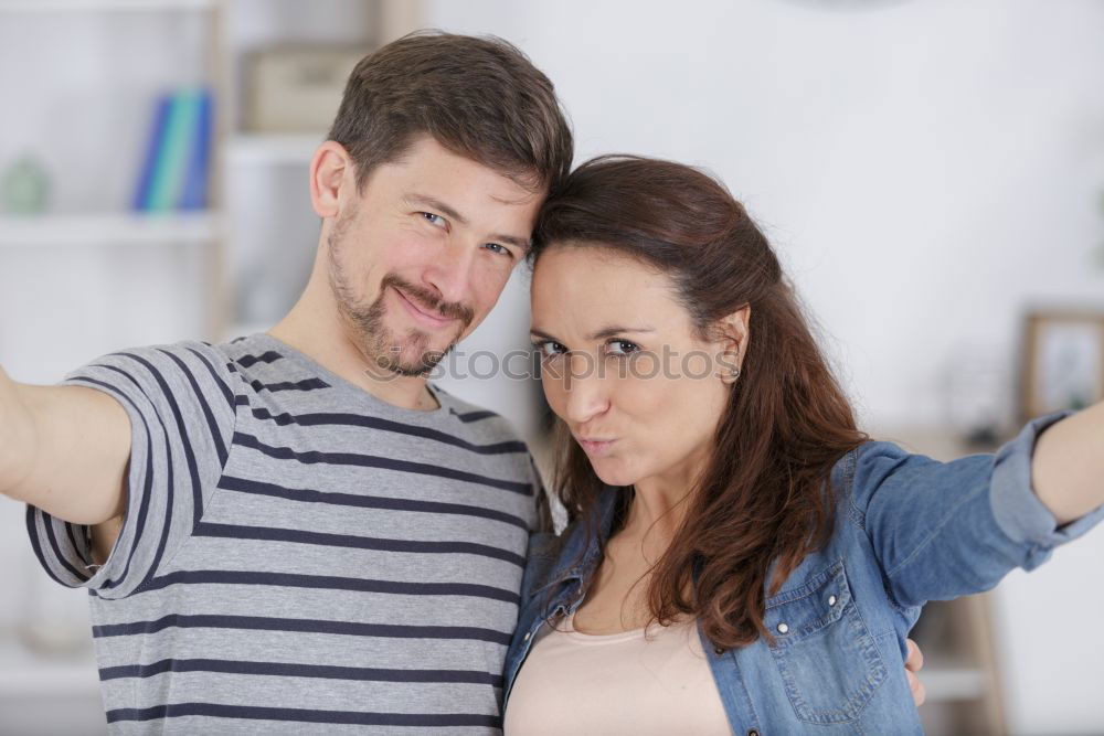 Similar – Young beautiful couple posing wearing jeans and t-shirt