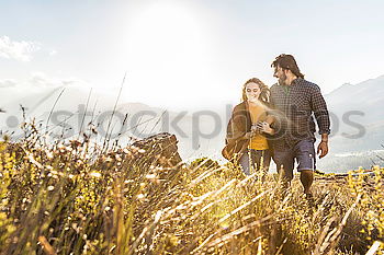 Similar – Image, Stock Photo two friends play with their dogs sitting in the meadow