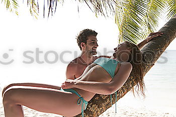 Similar – Image, Stock Photo A young man relaxing on his beach vacation