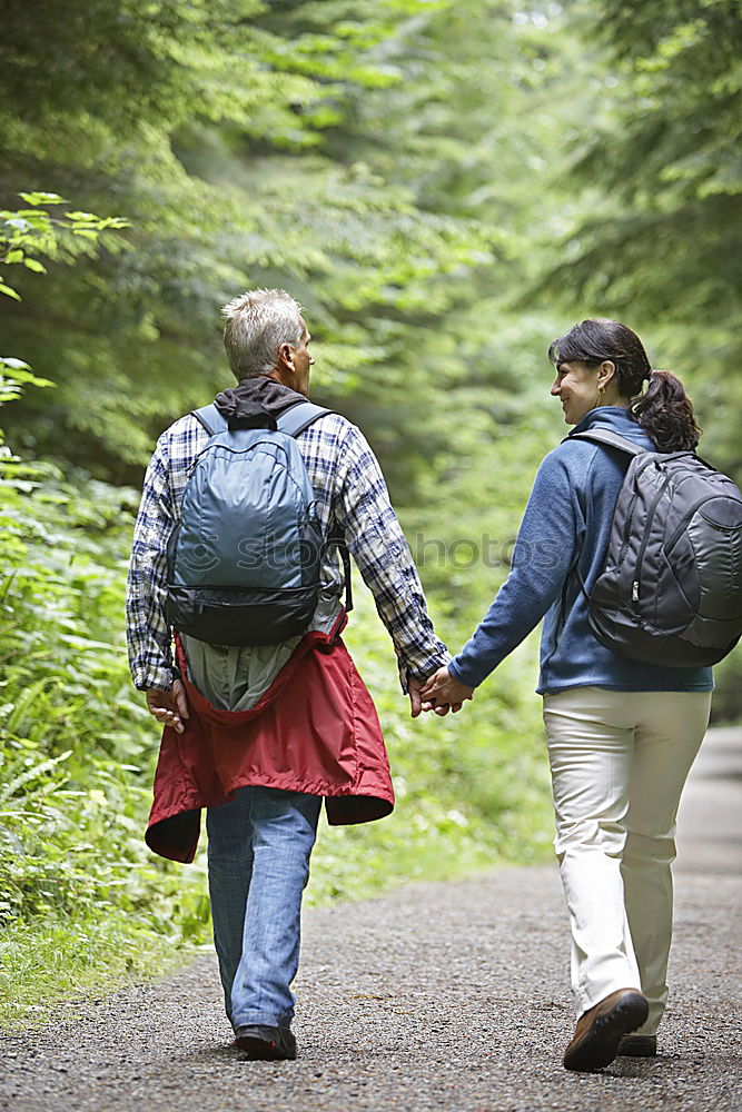 Similar – Boy and girl wandering in a forest on summer day