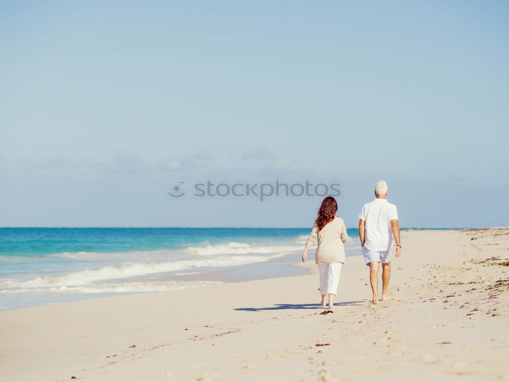 Similar – Image, Stock Photo Romantic bride and groom strolling on beach