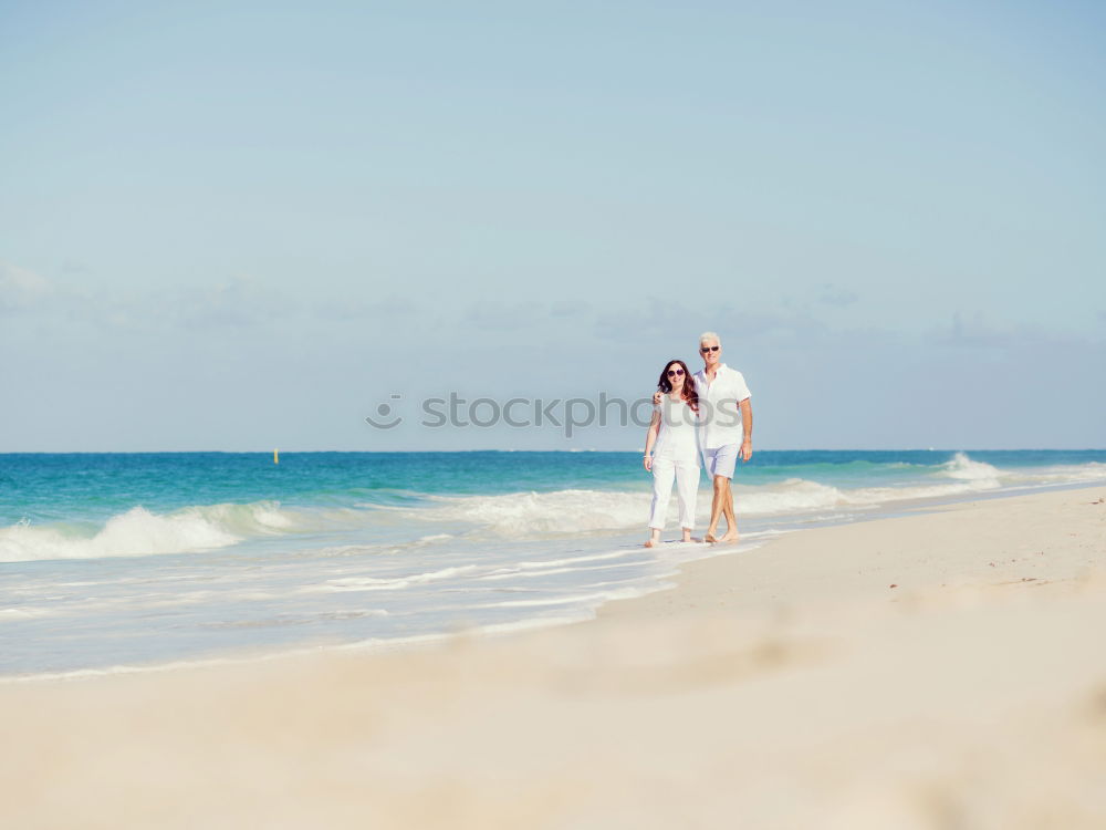 Similar – Image, Stock Photo Romantic bride and groom strolling on beach