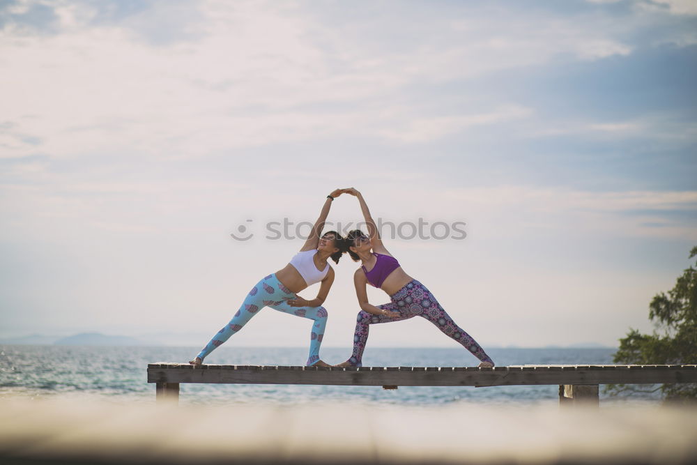 Similar – Two girls on the beach doing yoga at sunset. Lima Peru.