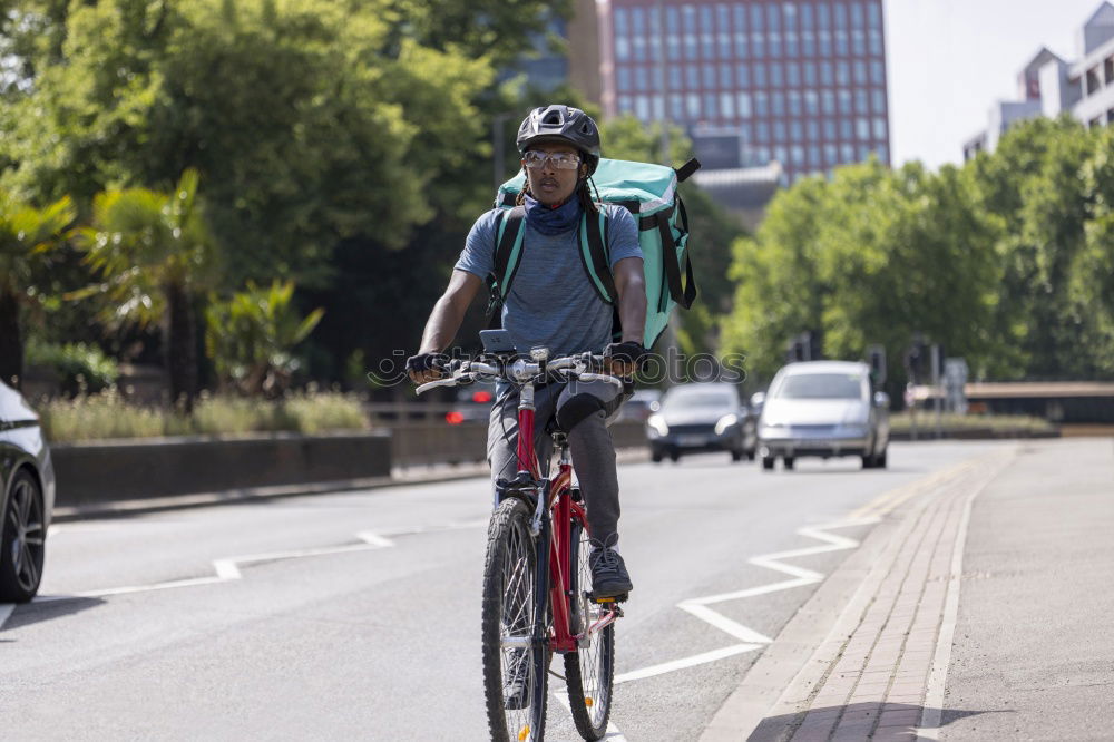 Similar – Handsome afro man relaxing near his bike.