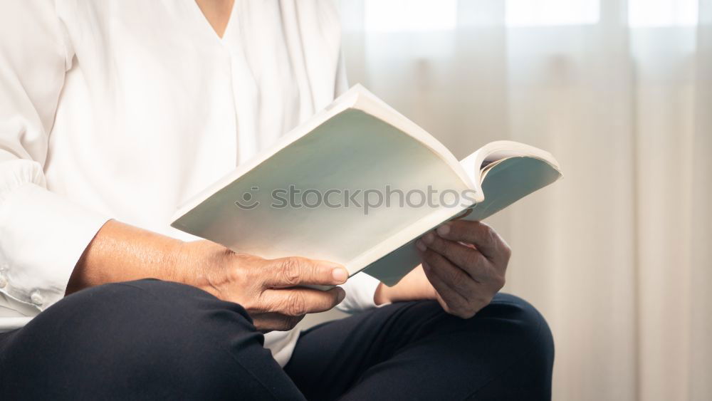 Similar – Image, Stock Photo Young couple reading book on couch at home