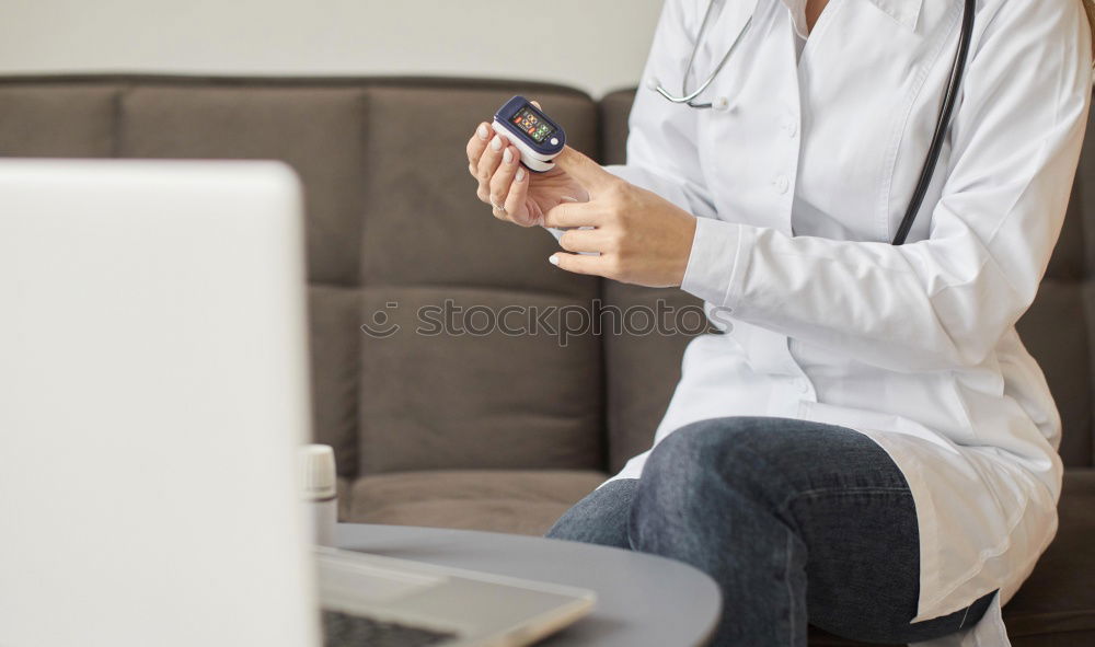 Similar – Mature woman sitting on couch at modern home