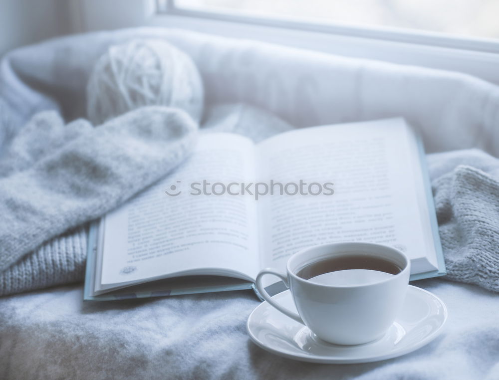 Similar – Image, Stock Photo woman reading a book and drinking coffee on bed with socks