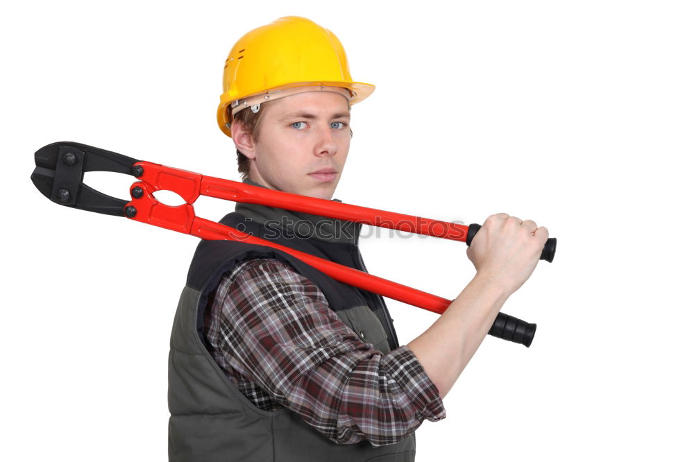 Similar – Worker man with hammer drill and building level at construction site