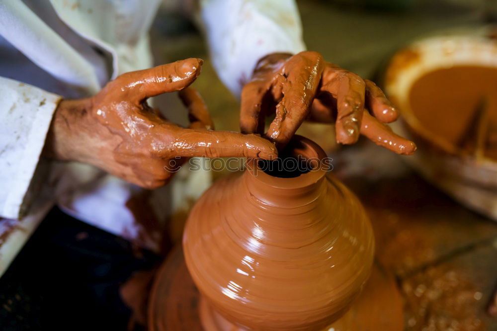 Similar – Potter making the pot in traditional style. Close up.