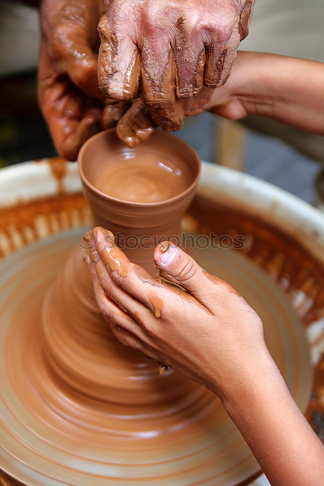 Similar – Potter making the pot in traditional style. Close up.