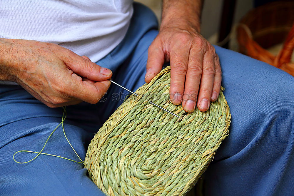 Similar – Close up of the hands of an elderly woman knitting sock