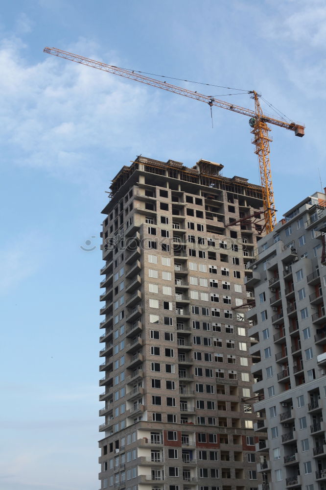 Similar – Construction site with building cranes