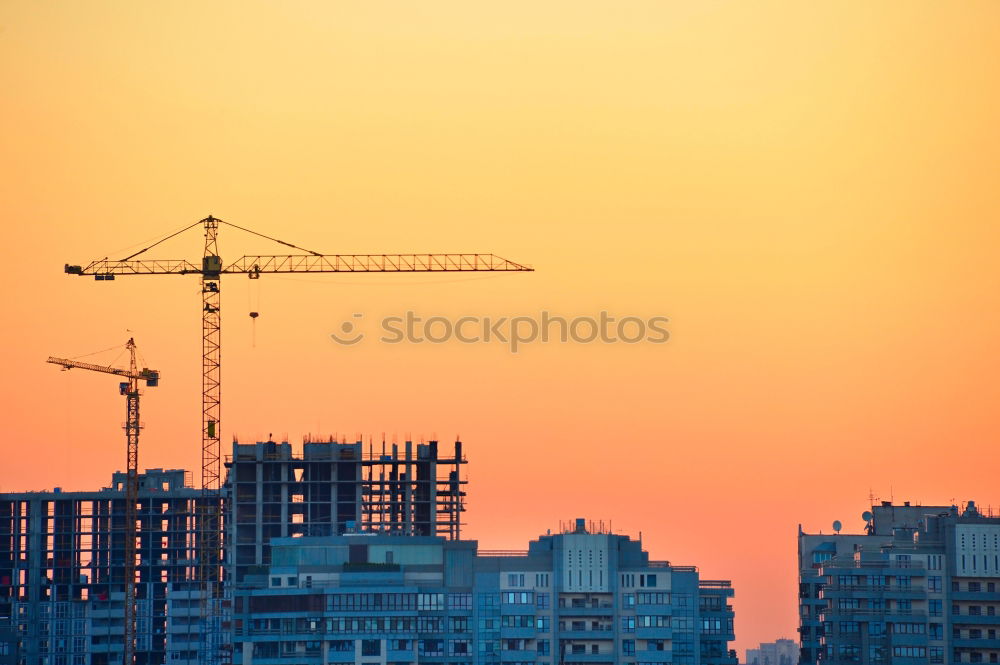 Similar – Construction site with building cranes