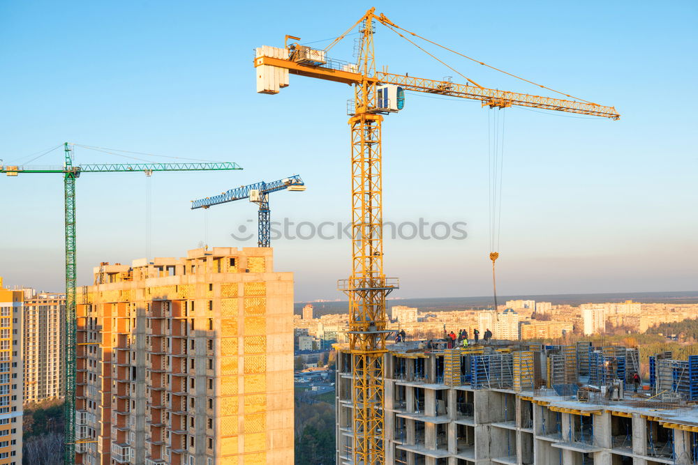 Similar – Construction site with building cranes