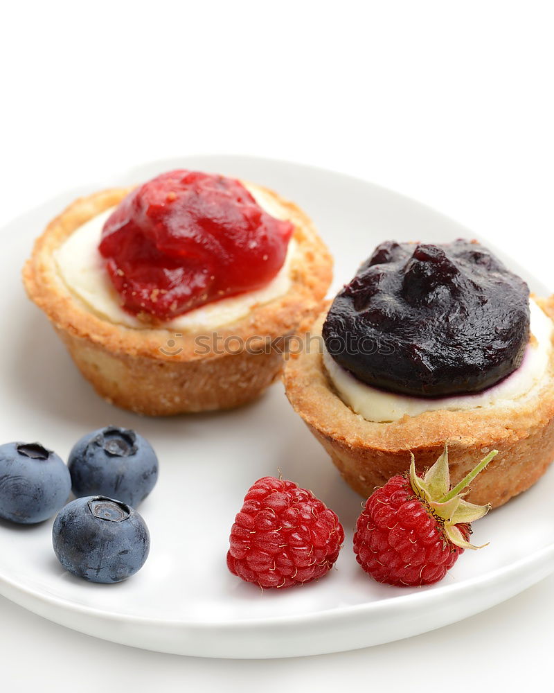 Similar – Delicious tartlets with raspberries and blueberries