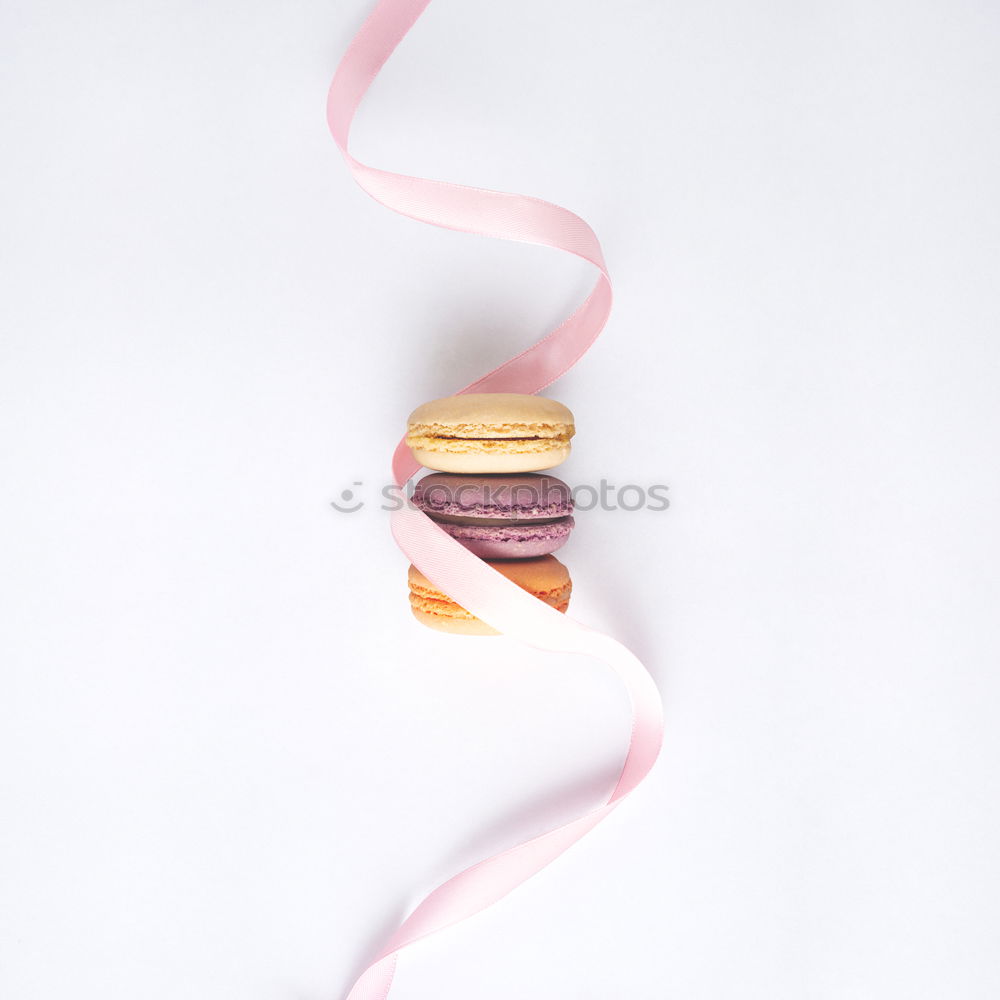 Similar – Image, Stock Photo A few gingerbread cookies wrapped in red ribbon on wooden table