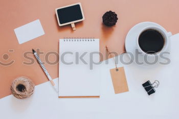 Similar – Blue office: note with pencil, sharpener, paper clips, eraser and a coffee cup