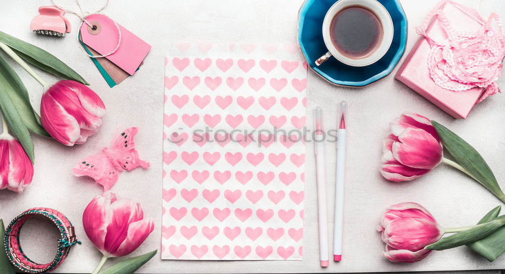 Similar – Table with cup of coffee, gift and pink tulips