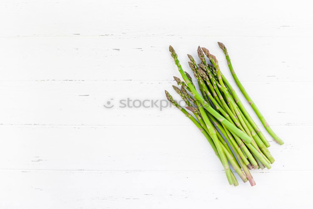 Similar – Image, Stock Photo Fresh raw asparagus spears on a white table