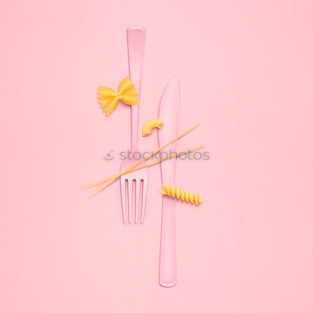 Similar – Plastic fork pattern on pink background