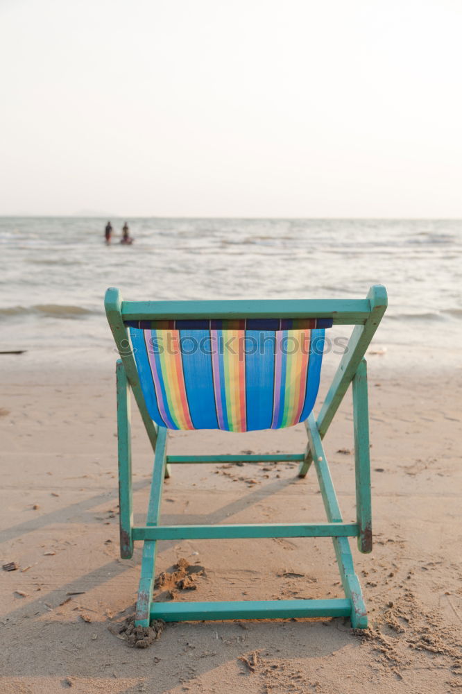 Similar – colorful Pedalos on the beach sand