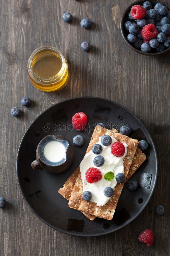 Similar – Delicious tartlets with raspberries and blueberries