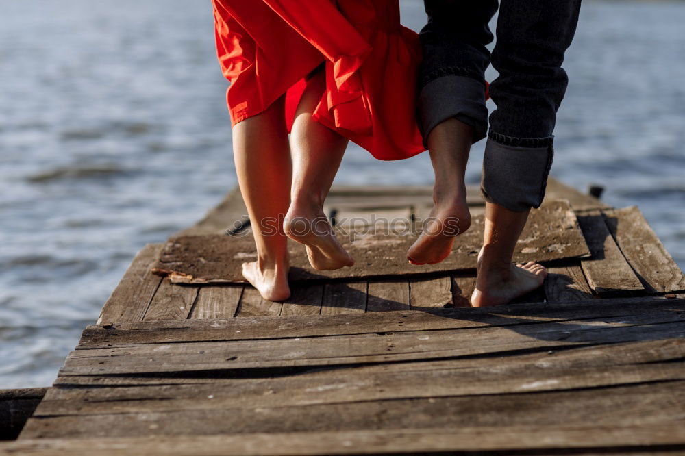 Similar – Image, Stock Photo Crop couple posing on pier