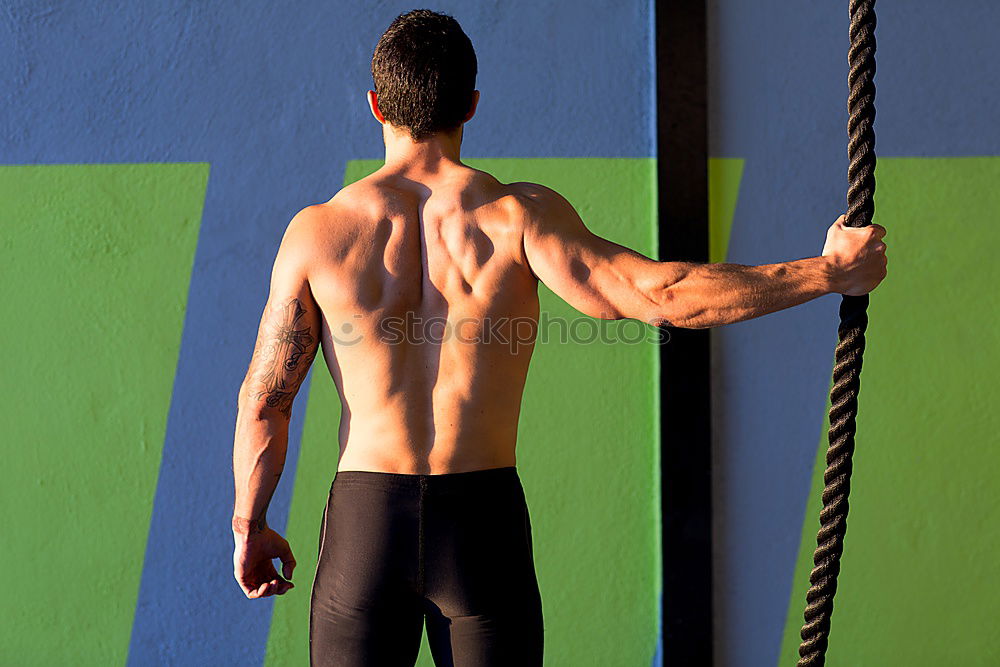 Similar – Young man stretching a resistance rubber band before calisthenics training