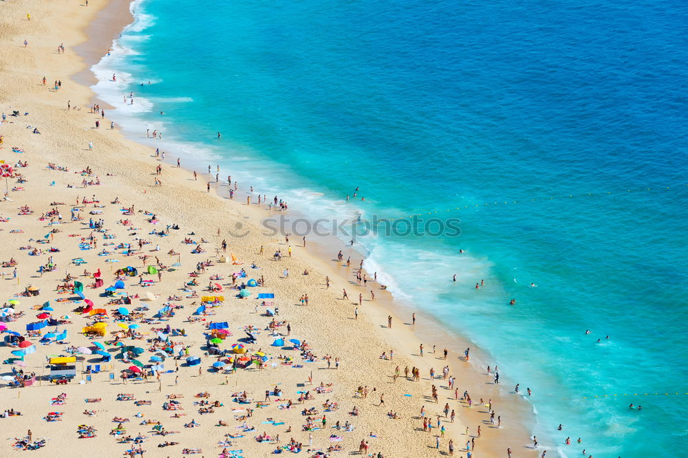 Similar – Drone shot of many people enjoying the beach and the ocean in high season- vacation pattern.