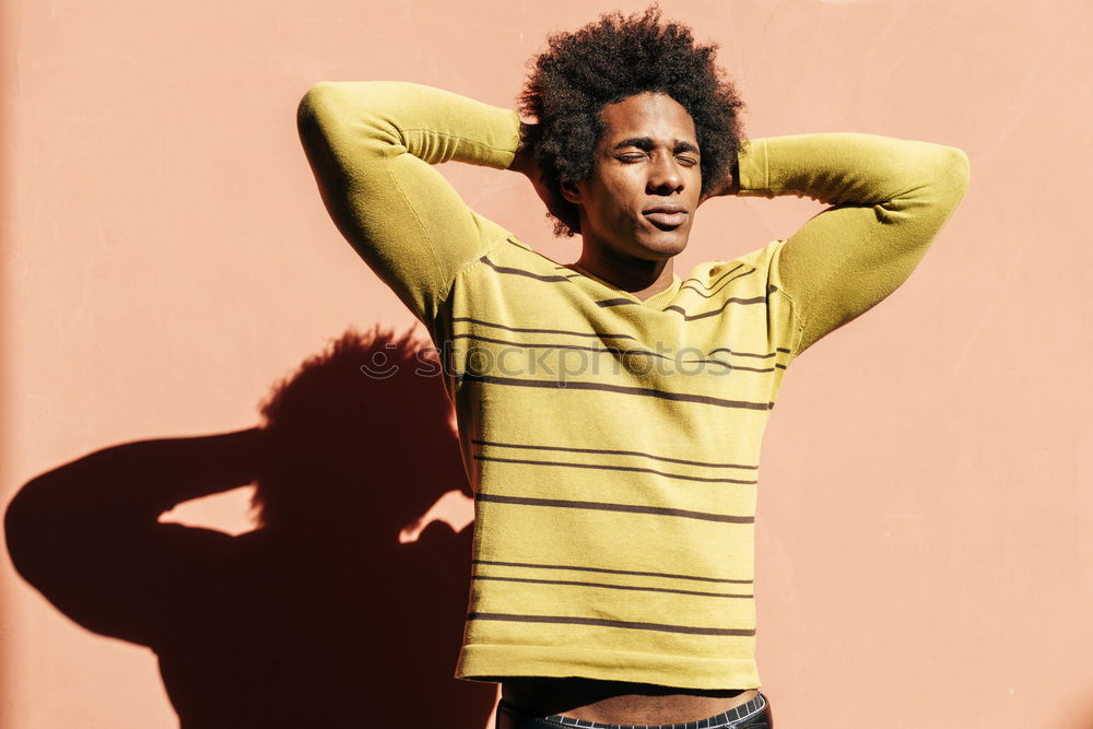 Similar – Image, Stock Photo Black man with afro hair putting on sunglasses. Sunglasses and a